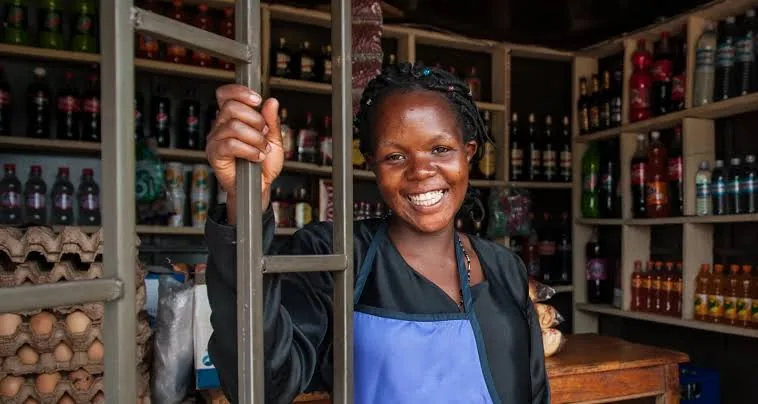 A shop owner at her counter